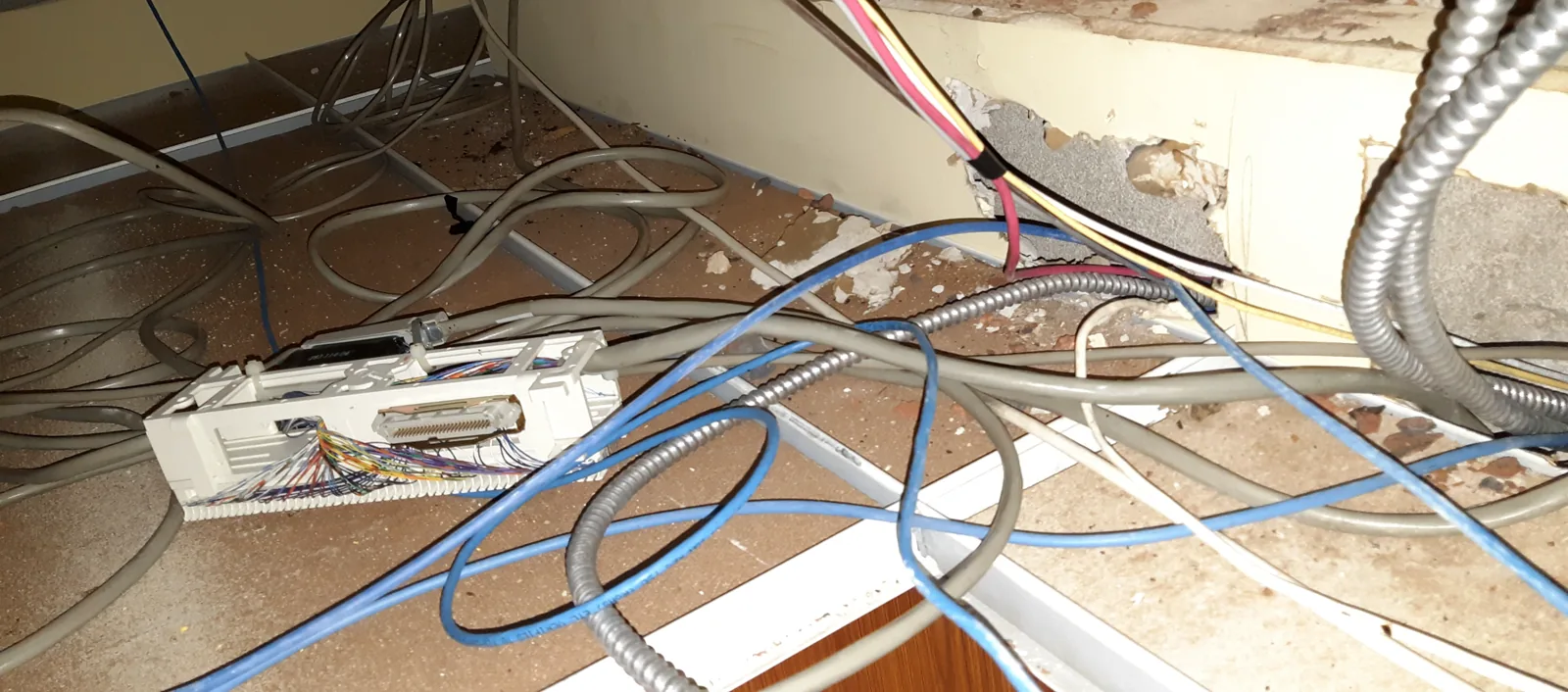Open office ceiling filled with loose cable
