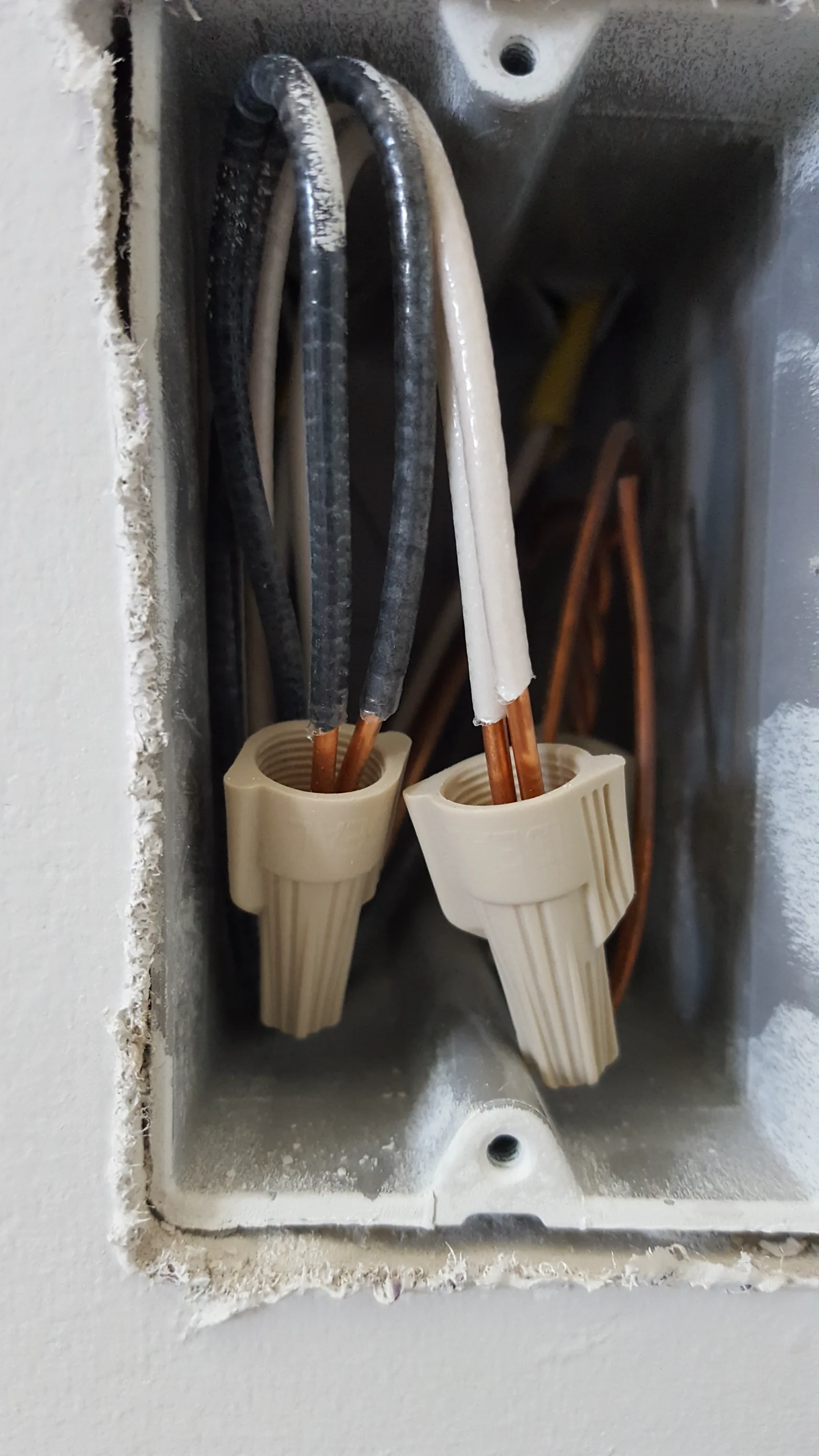 Improvised wiring support near a sprinkler pipe
