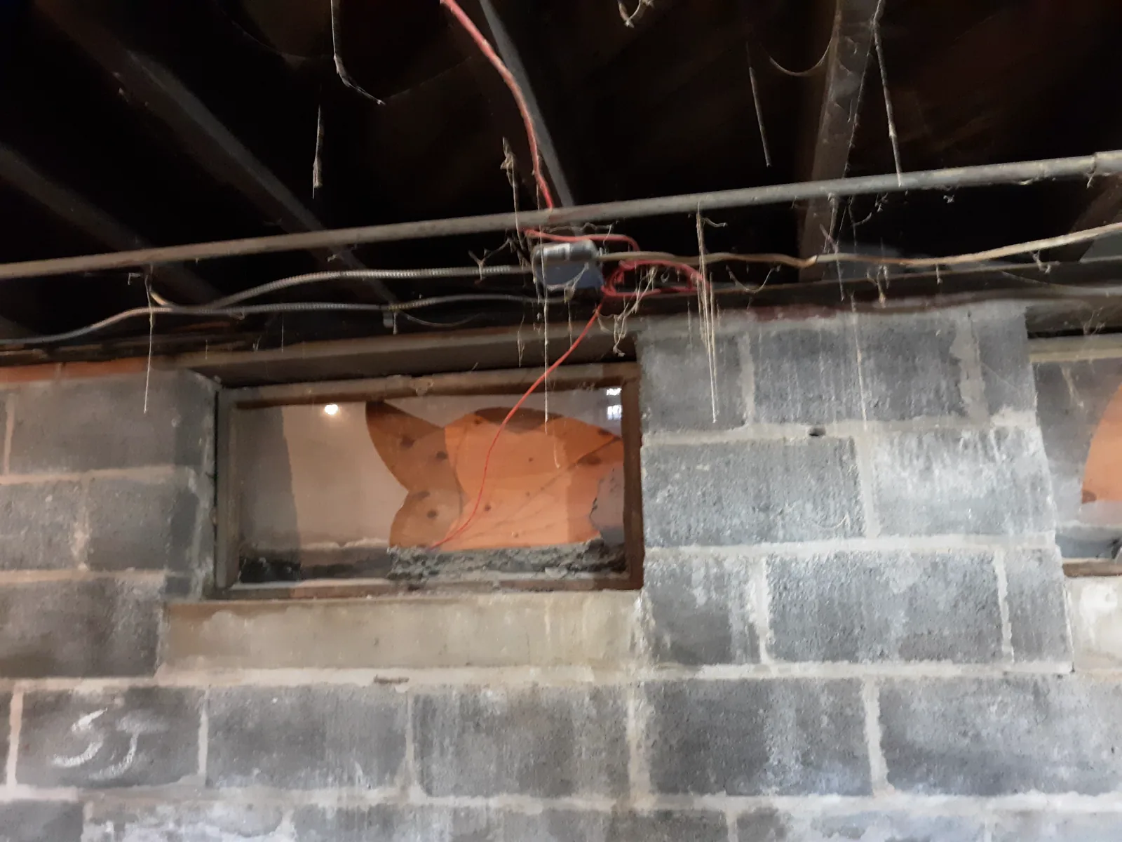 Fire-alarm wire run through damaged material