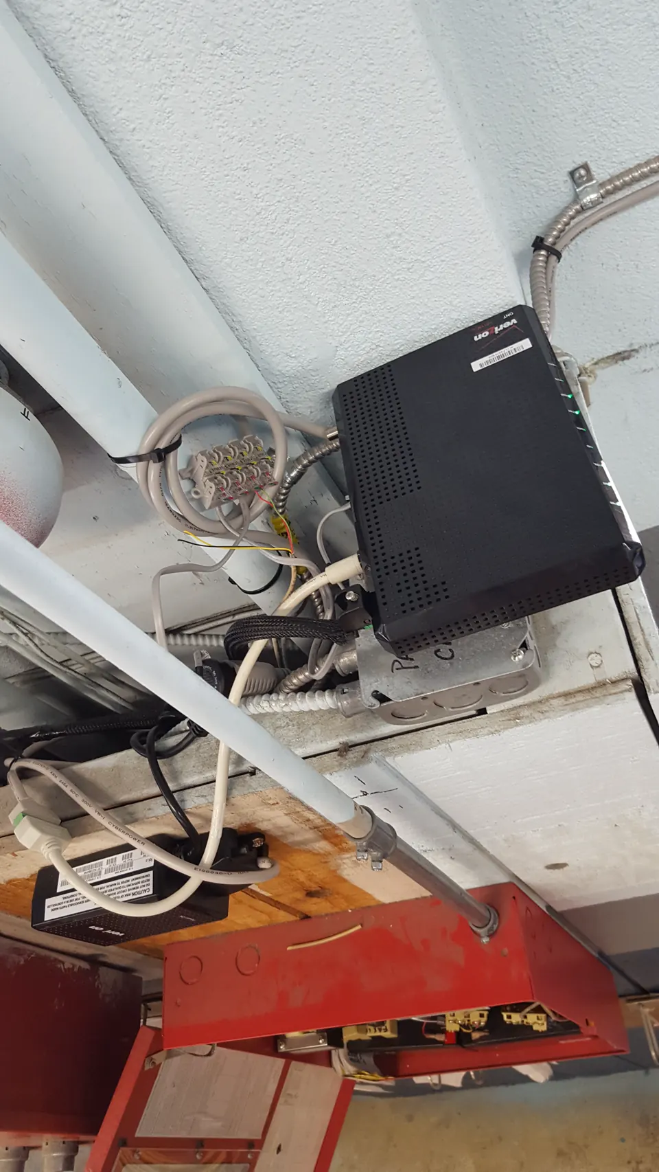 Fiber equipment mounted among exposed terminations and crowded electrical boxes